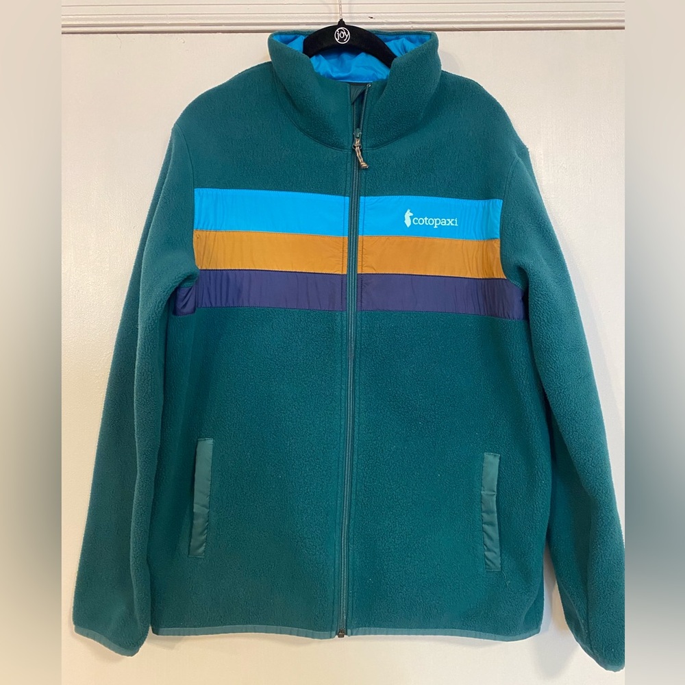cotopaxi Teal Fleece Jacket with Blue, Gold & Purple Stripes
